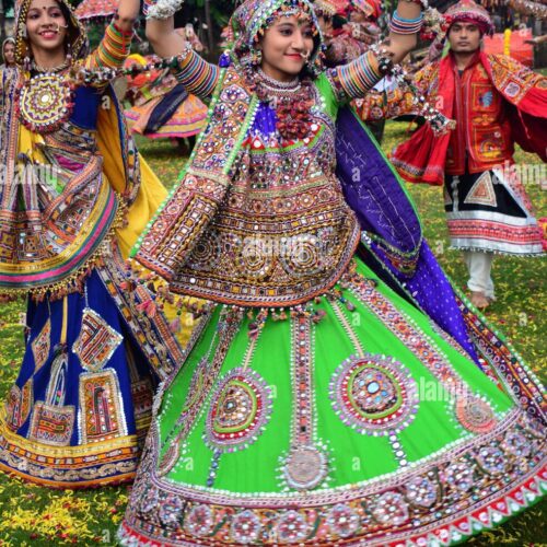 girls-in-traditional-attire-practice-the-garba-dance-steps-in-preparation-HAF478
